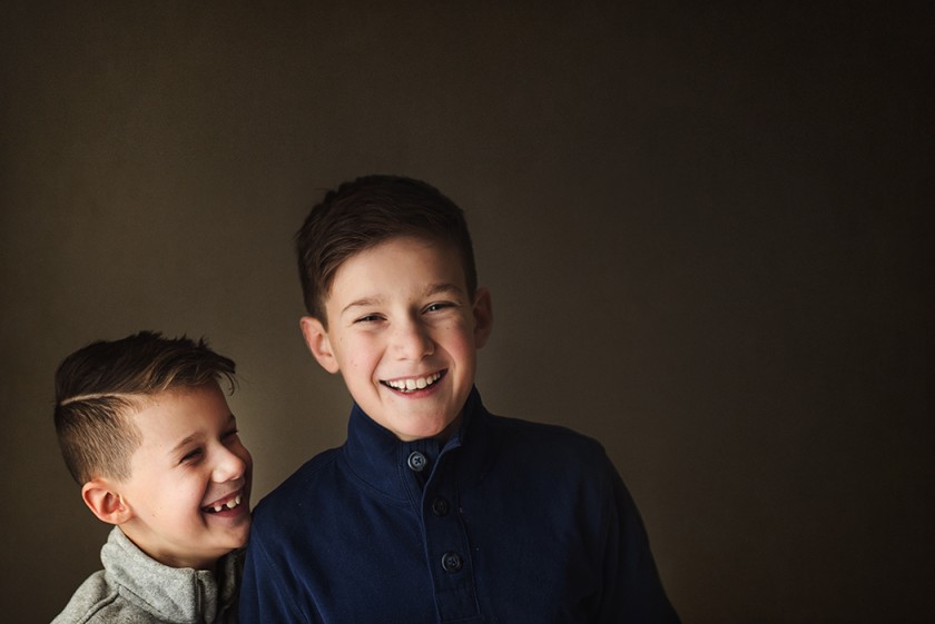 photo of two boys laughing together by Kellie Bieser