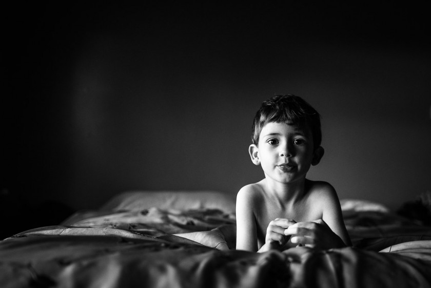 picture of child laying on the bed by Heather Mohr