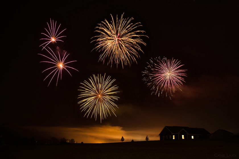 fireworks show by a house in the country by Cathie Lauck