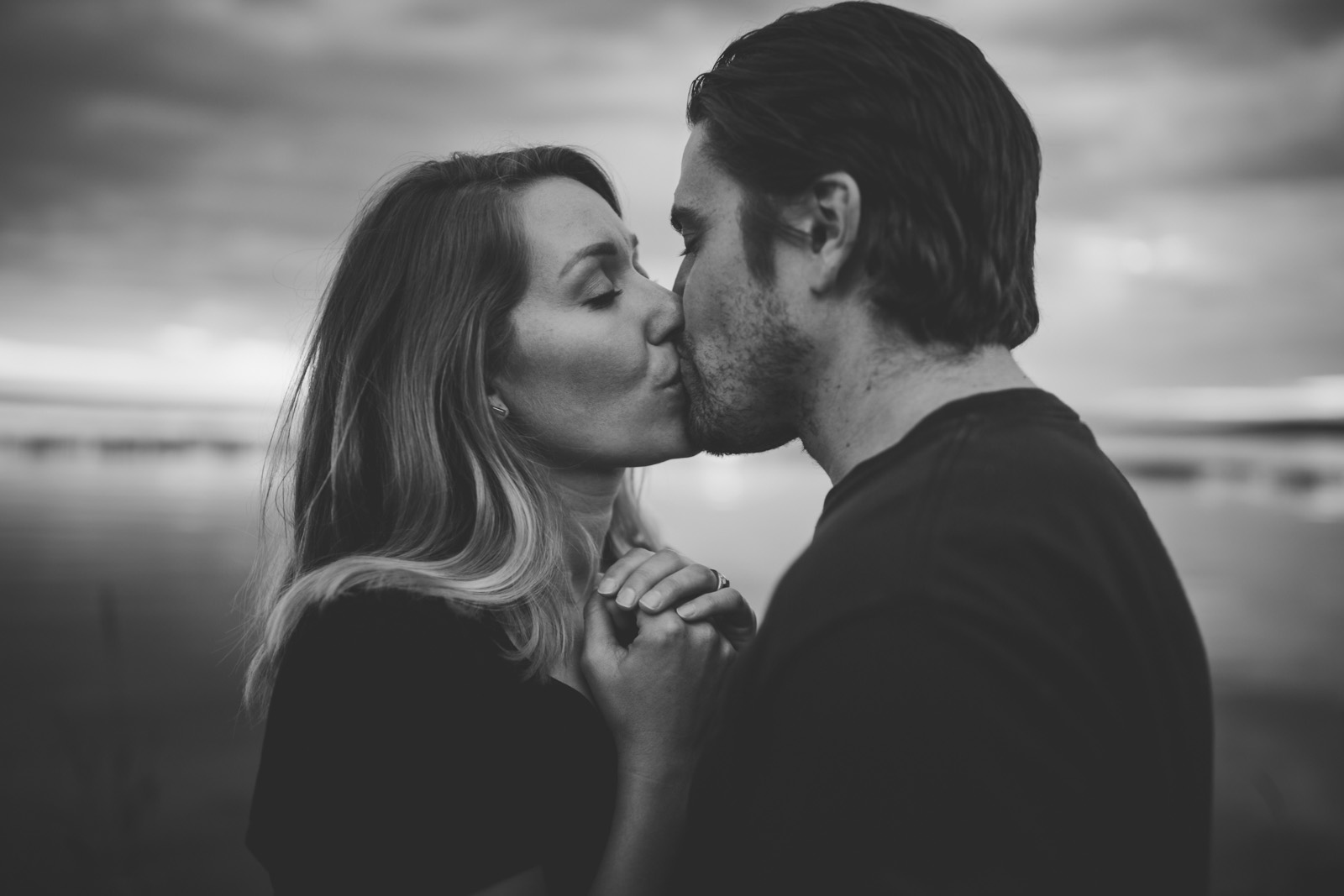 photo of couple kissing in black and white by Andrea Brooke Photography