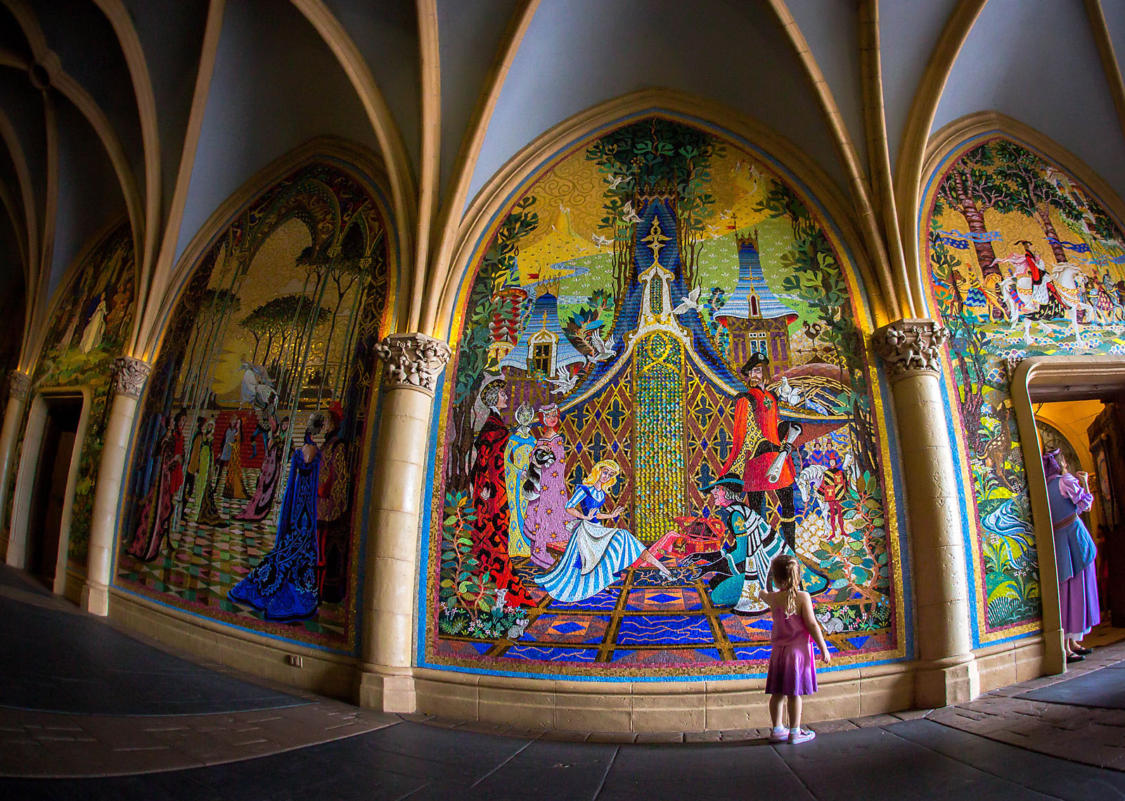 picture of girl looking at Disney World Sleeping Beauty art by Dana Nicole Photography