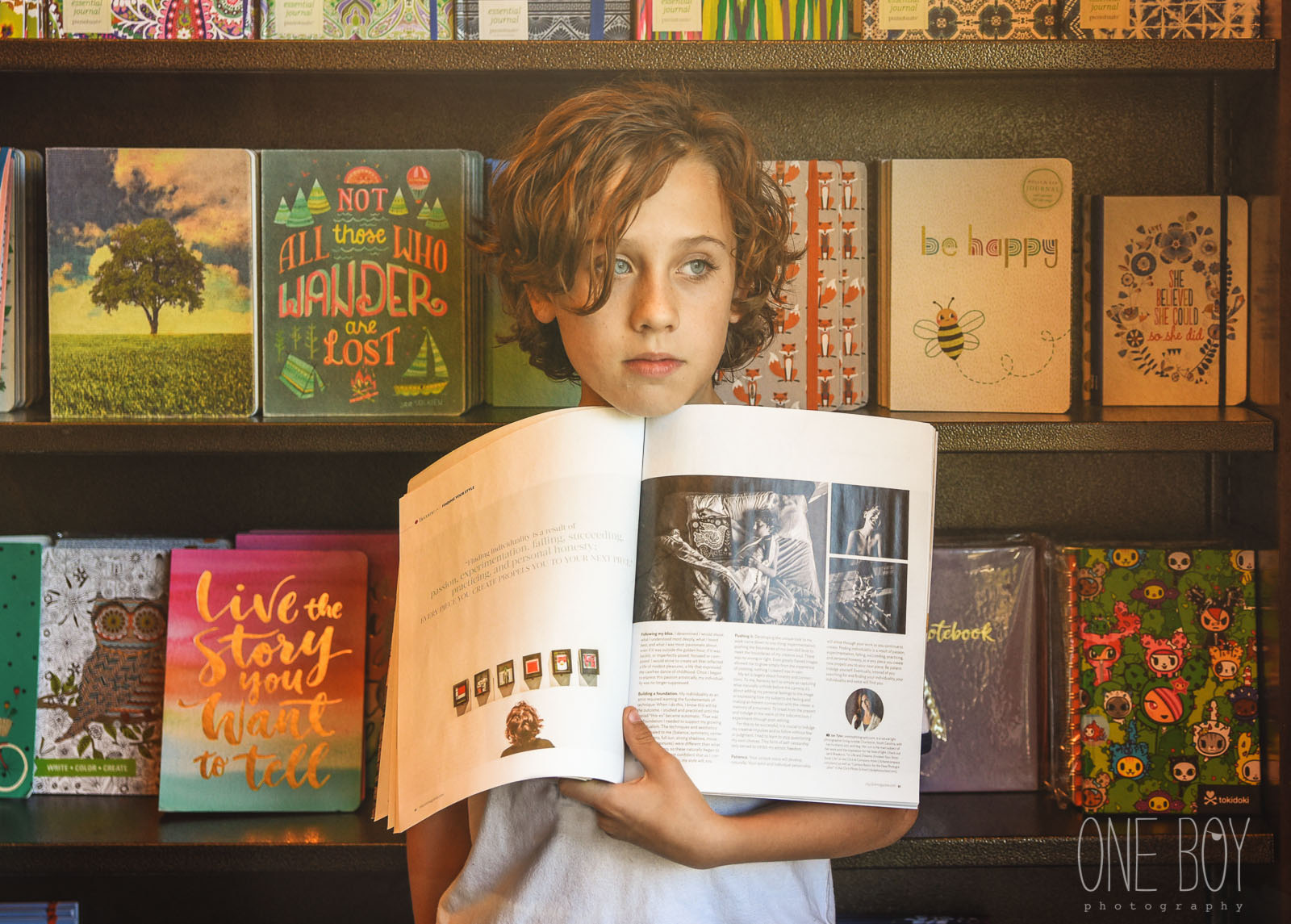 photo of boy holding a copy of Click Magazine by Jan Tyler